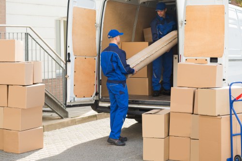 Removal van and moving boxes in a Lambeth residential street