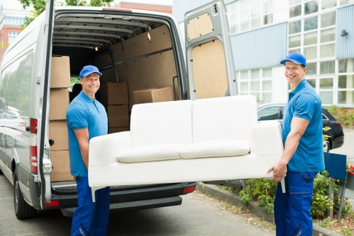 Team loading moving boxes safely into a van