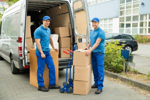 Packed household boxes and wrapped furniture ready for transport