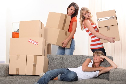 Professional movers handling furniture during a Lambeth home move